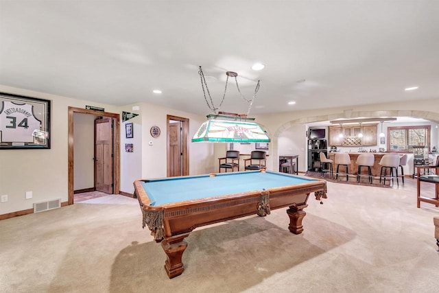 game room featuring billiards, bar area, and light carpet