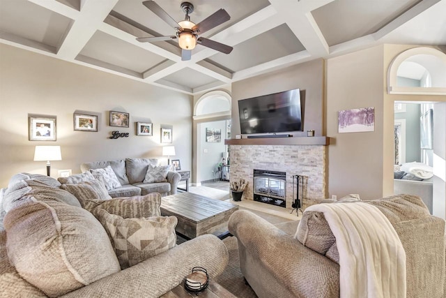 living room featuring coffered ceiling, beam ceiling, and ceiling fan