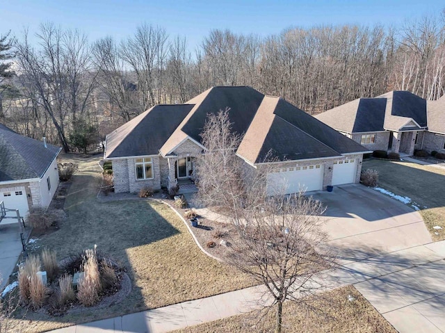 view of front of house with a garage and a front yard