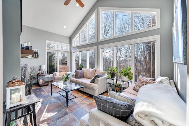 sunroom featuring vaulted ceiling and ceiling fan