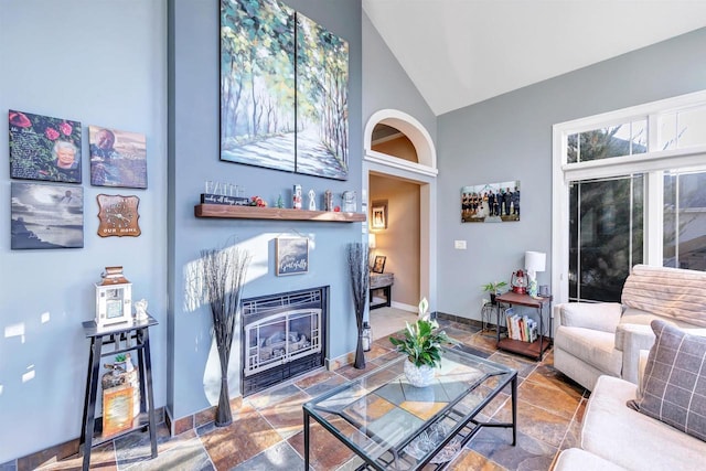 living room featuring lofted ceiling