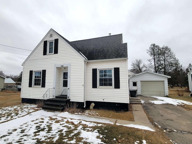 view of front of house with an outbuilding and a garage