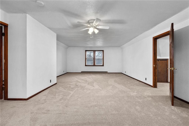 bonus room featuring ceiling fan, light colored carpet, a textured ceiling, and baseboard heating