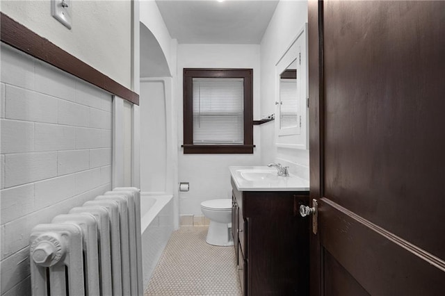 full bathroom with radiator, tile patterned flooring, vanity, bathtub / shower combination, and toilet