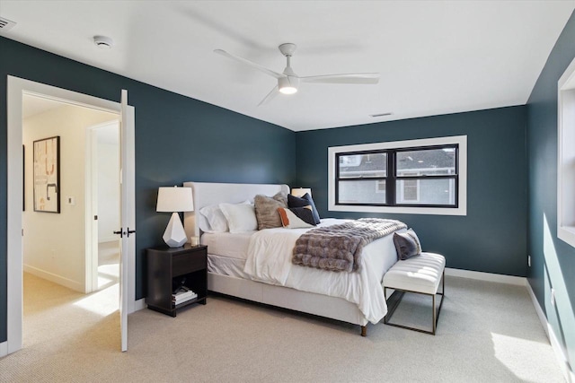 bedroom featuring light carpet and ceiling fan