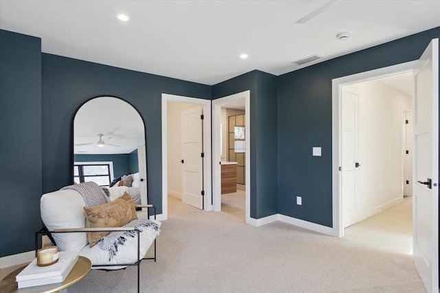 sitting room featuring light carpet