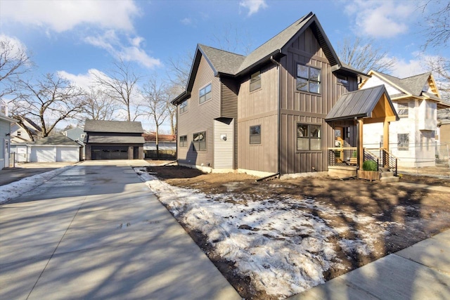 view of home's exterior with an outbuilding and a garage