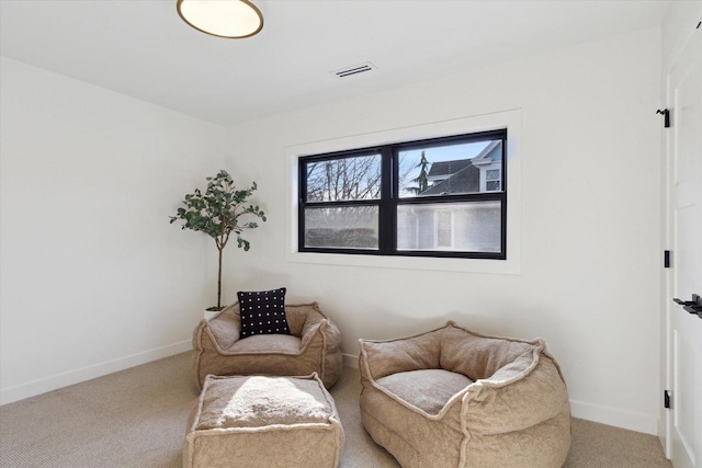 living area with light colored carpet