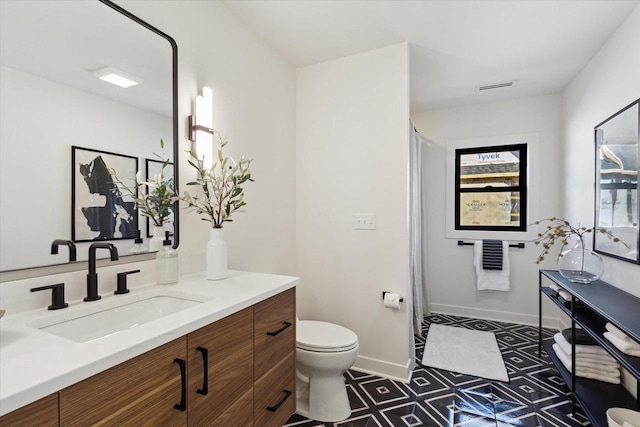 bathroom with vanity and toilet