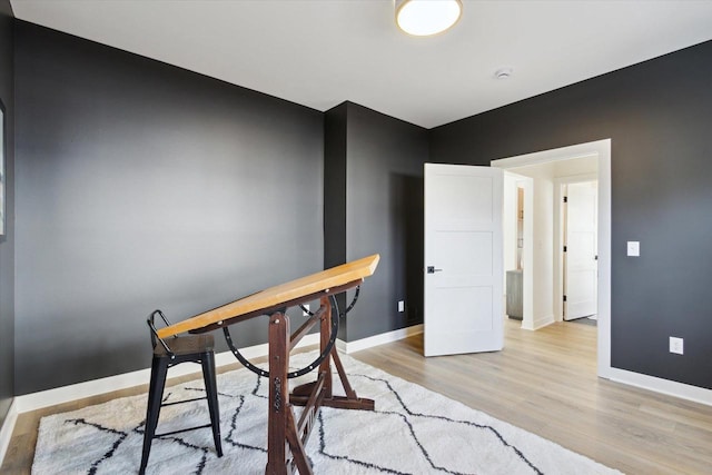 office area with light hardwood / wood-style floors