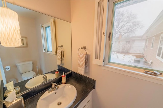 bathroom featuring vanity and toilet