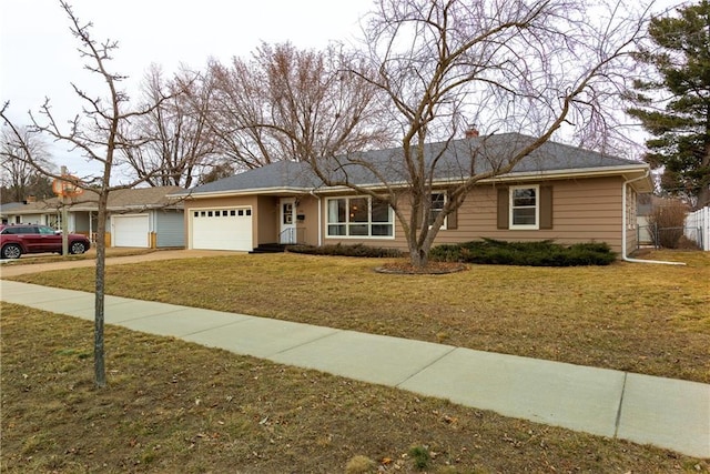 ranch-style home featuring a garage and a front yard