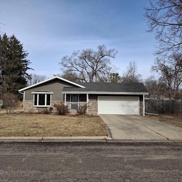 ranch-style home featuring a front yard and a garage