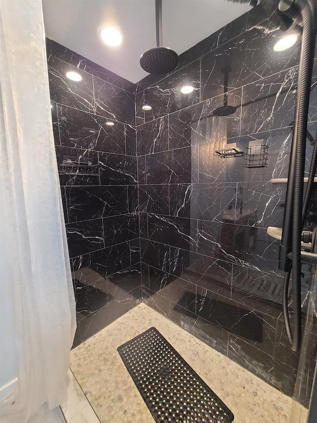 bathroom with tiled shower