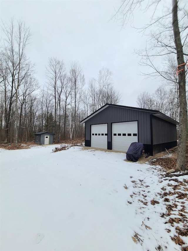 view of snow covered garage