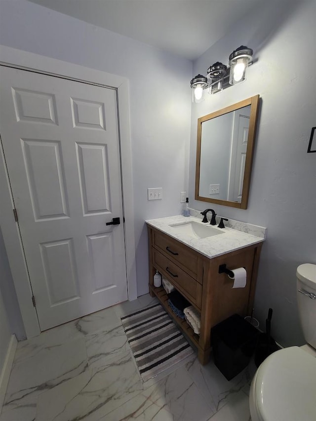 bathroom with vanity and toilet