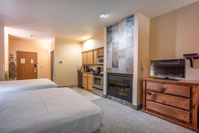 tiled bedroom featuring a tile fireplace