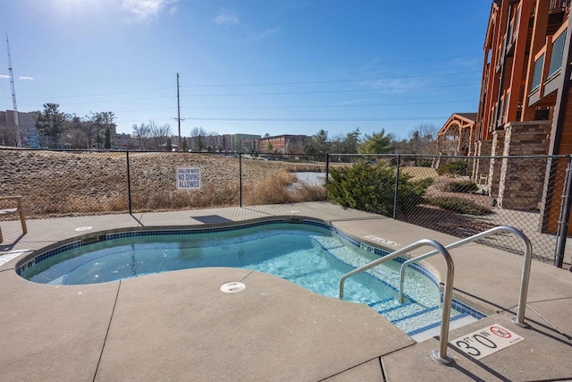 view of pool featuring a patio area