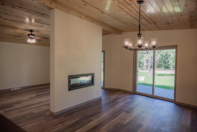 unfurnished living room featuring a multi sided fireplace, vaulted ceiling with beams, and wooden ceiling