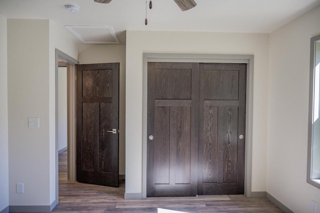 unfurnished bedroom with wood-type flooring and a closet