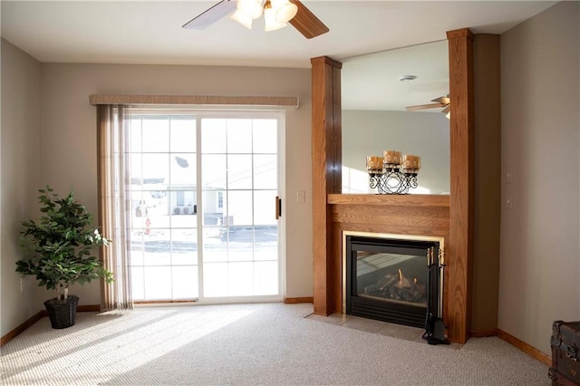 interior space with light carpet and ceiling fan