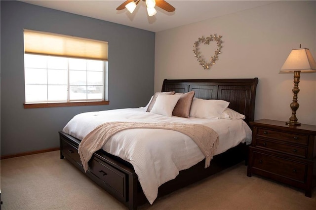 bedroom featuring light colored carpet and ceiling fan