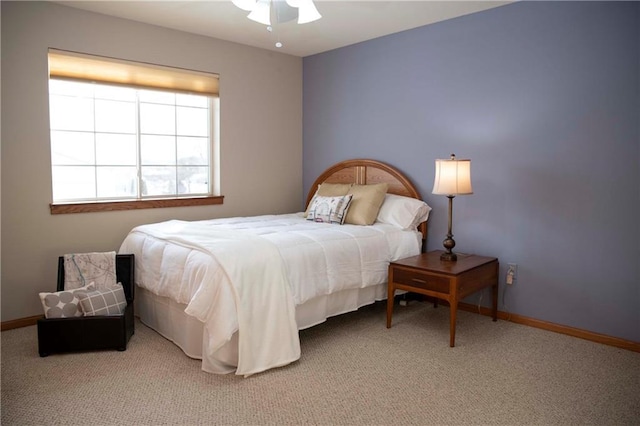 bedroom with ceiling fan and carpet