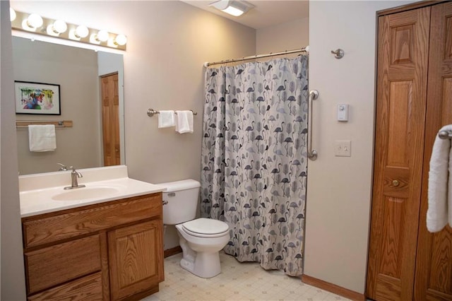 bathroom with vanity, toilet, and a shower with shower curtain