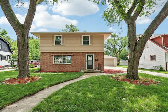 view of front of property with a garage, an outdoor structure, and a front lawn