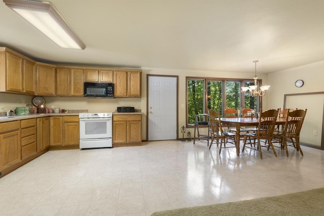 kitchen featuring pendant lighting, white electric range, and a chandelier