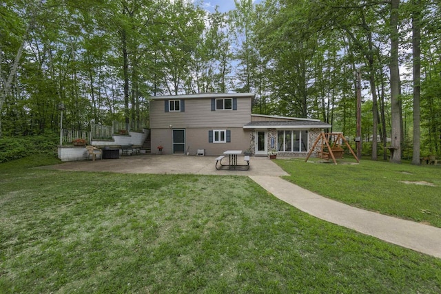 back of property with cooling unit, a patio area, a playground, and a lawn