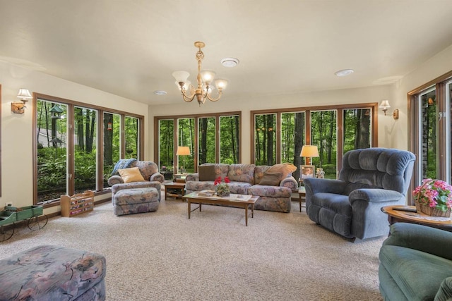 sunroom / solarium with an inviting chandelier