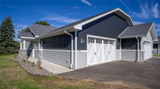 view of side of property with a garage