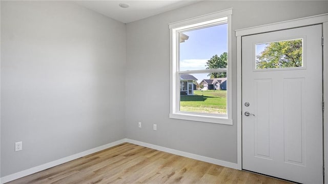 entryway with light hardwood / wood-style floors