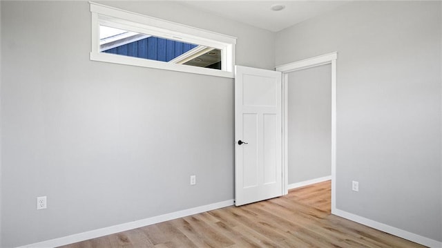 unfurnished room featuring light wood-type flooring