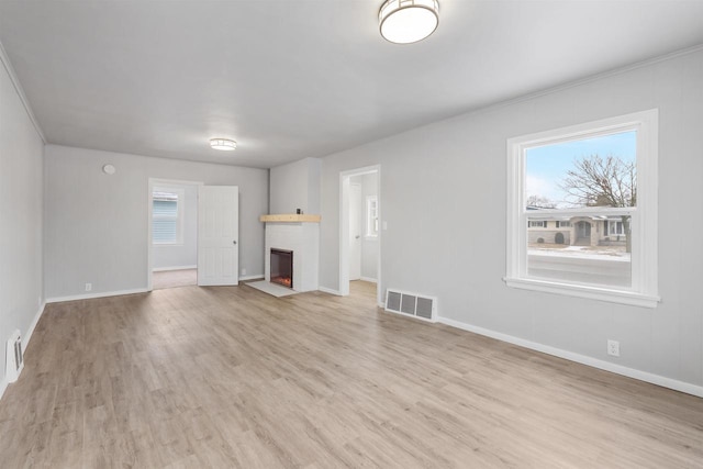 unfurnished living room featuring light hardwood / wood-style flooring