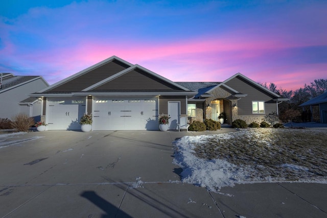 ranch-style house featuring a garage