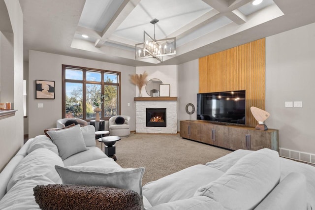 carpeted living room featuring coffered ceiling, beam ceiling, a fireplace, and a chandelier