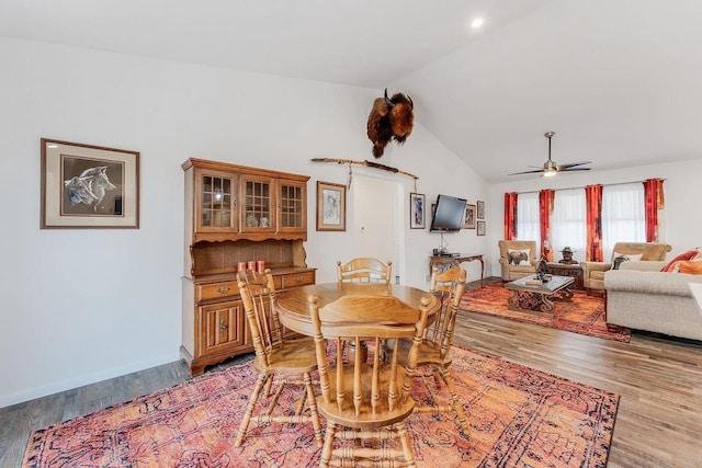 dining space featuring vaulted ceiling, ceiling fan, and light hardwood / wood-style floors