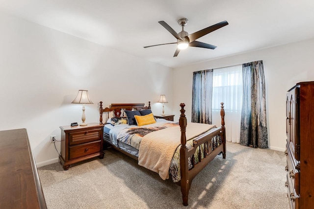 bedroom featuring light colored carpet and ceiling fan