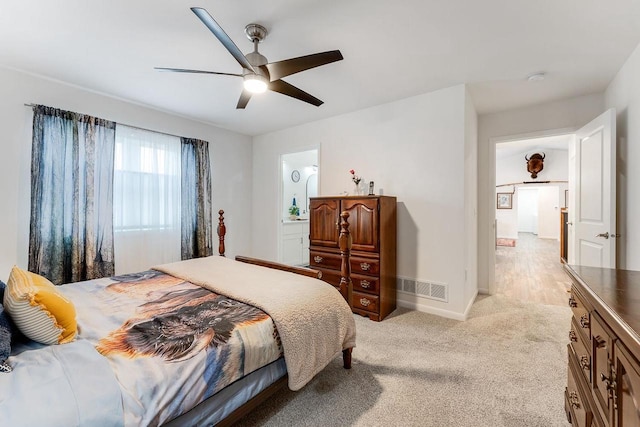 bedroom featuring ceiling fan and light colored carpet