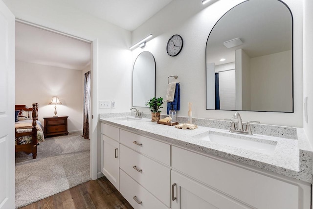 bathroom with vanity and hardwood / wood-style flooring