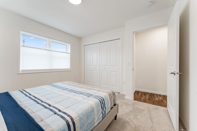 bedroom with carpet flooring and a closet