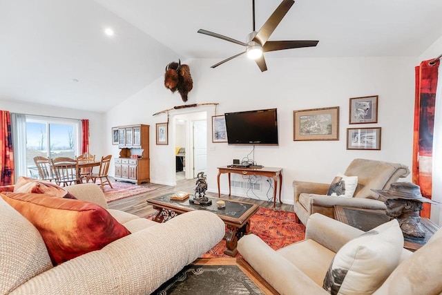 living room featuring lofted ceiling, hardwood / wood-style floors, and ceiling fan