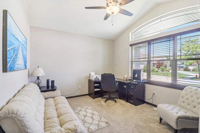 carpeted office featuring vaulted ceiling and ceiling fan