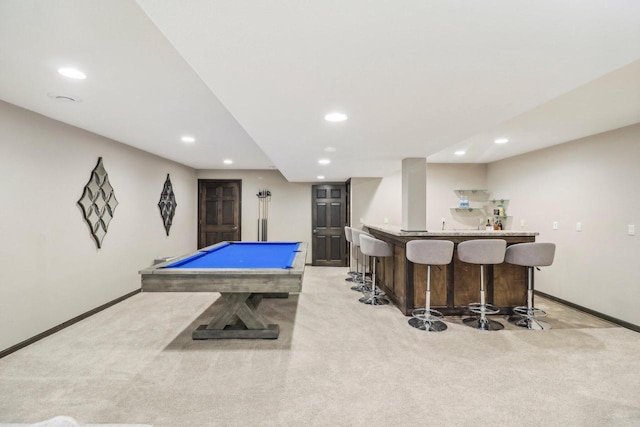 game room with bar, light carpet, and billiards