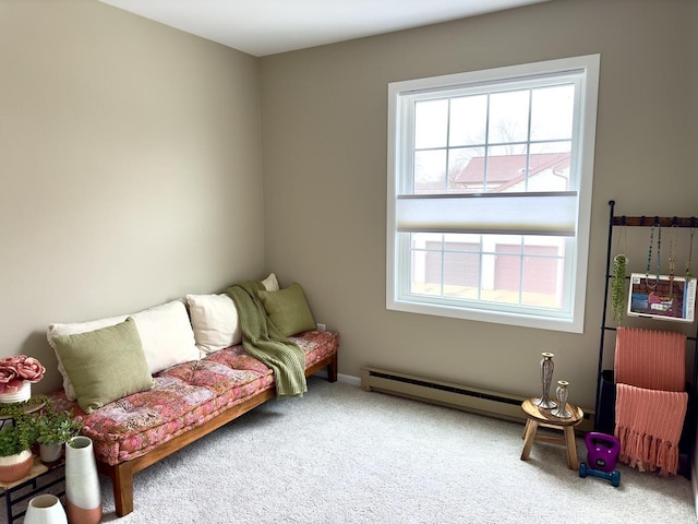 sitting room with carpet flooring and baseboard heating