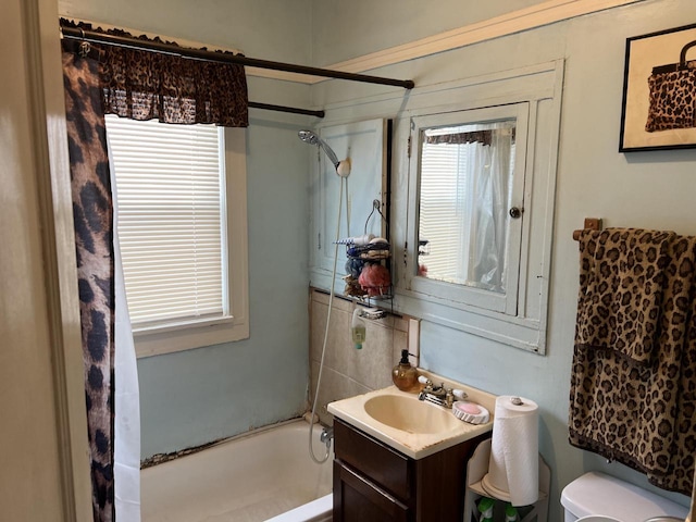 full bathroom with vanity, shower / bathtub combination, and toilet