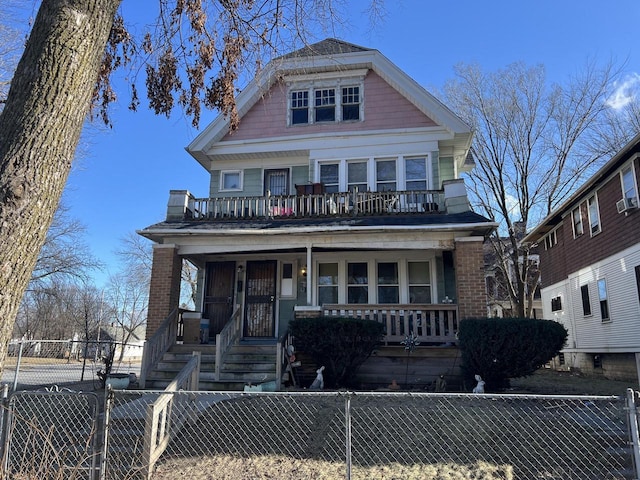 view of front facade featuring a balcony and a porch