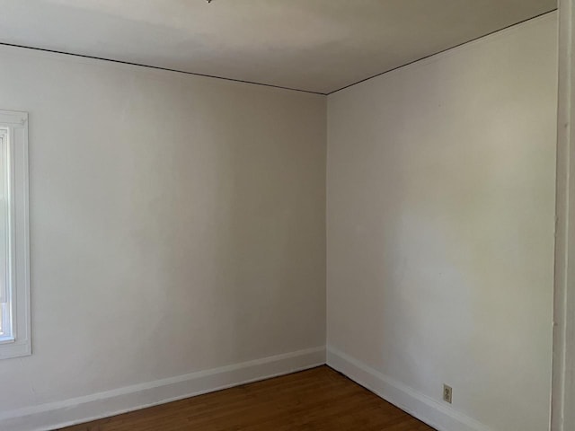 spare room with hardwood / wood-style floors